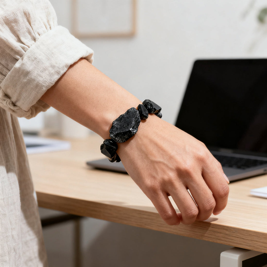 Black obsidian crystal bracelet worn on wrist for emotional protection and grounding practice