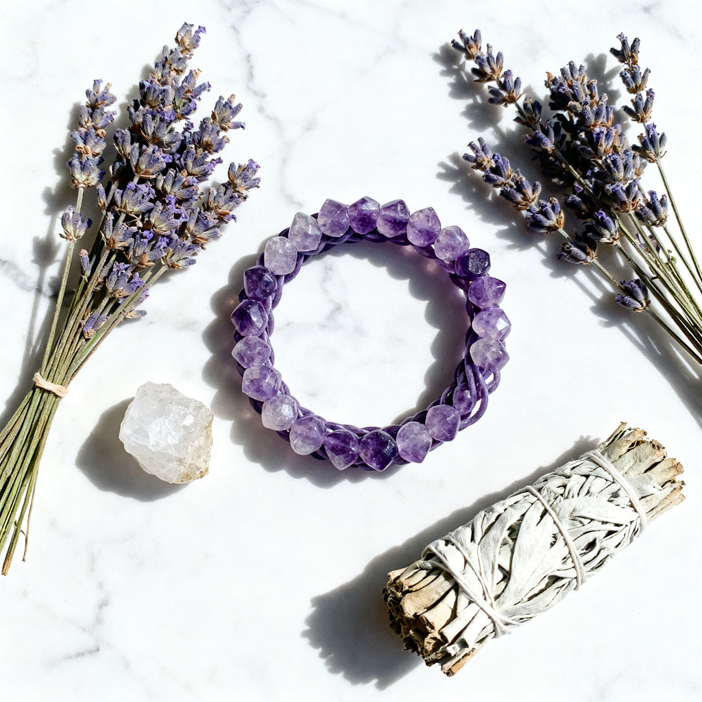 Amethyst bracelet flat lay with crystals and lavender - aesthetic composition