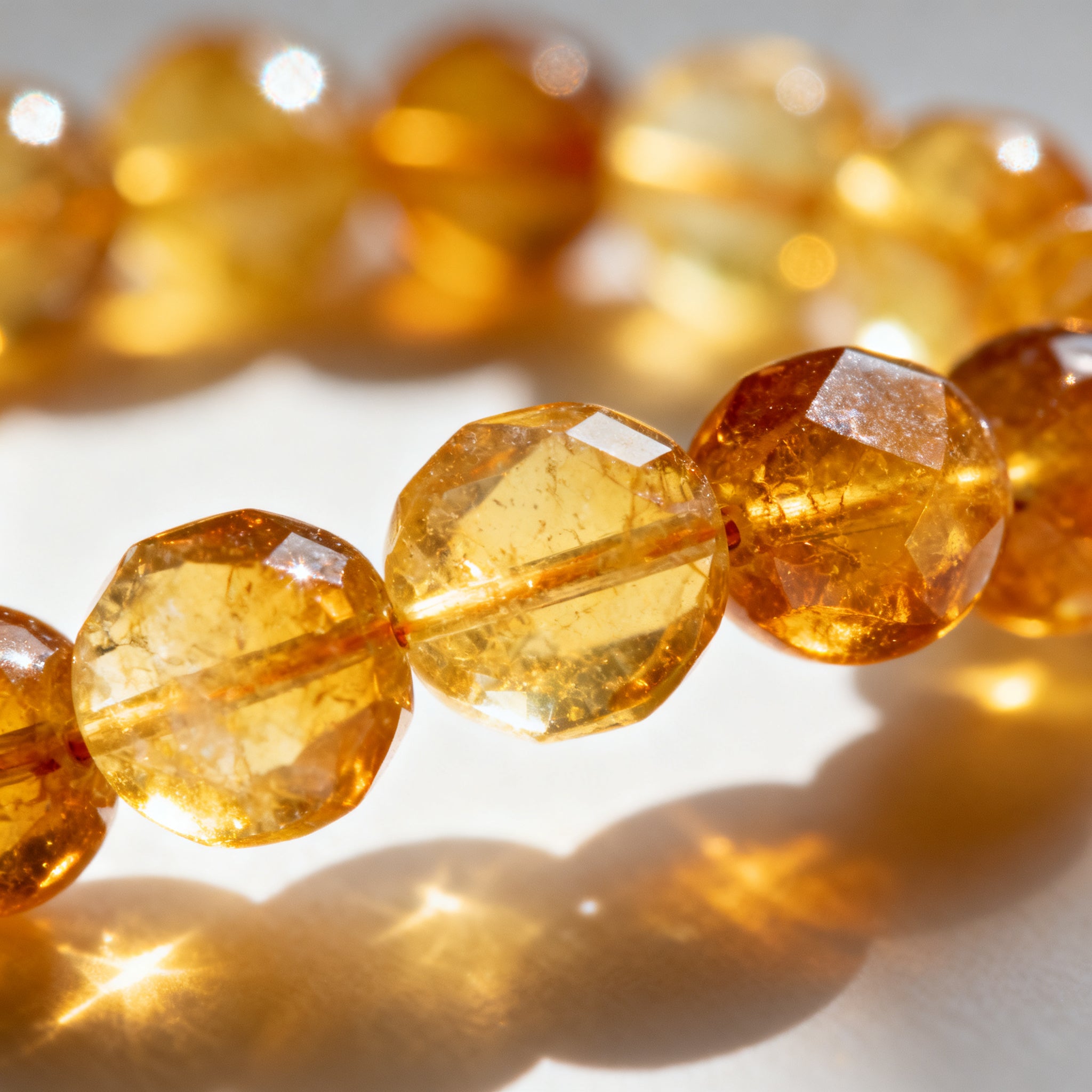 Closeup detail of golden Citrine crystal beads - honey amber texture