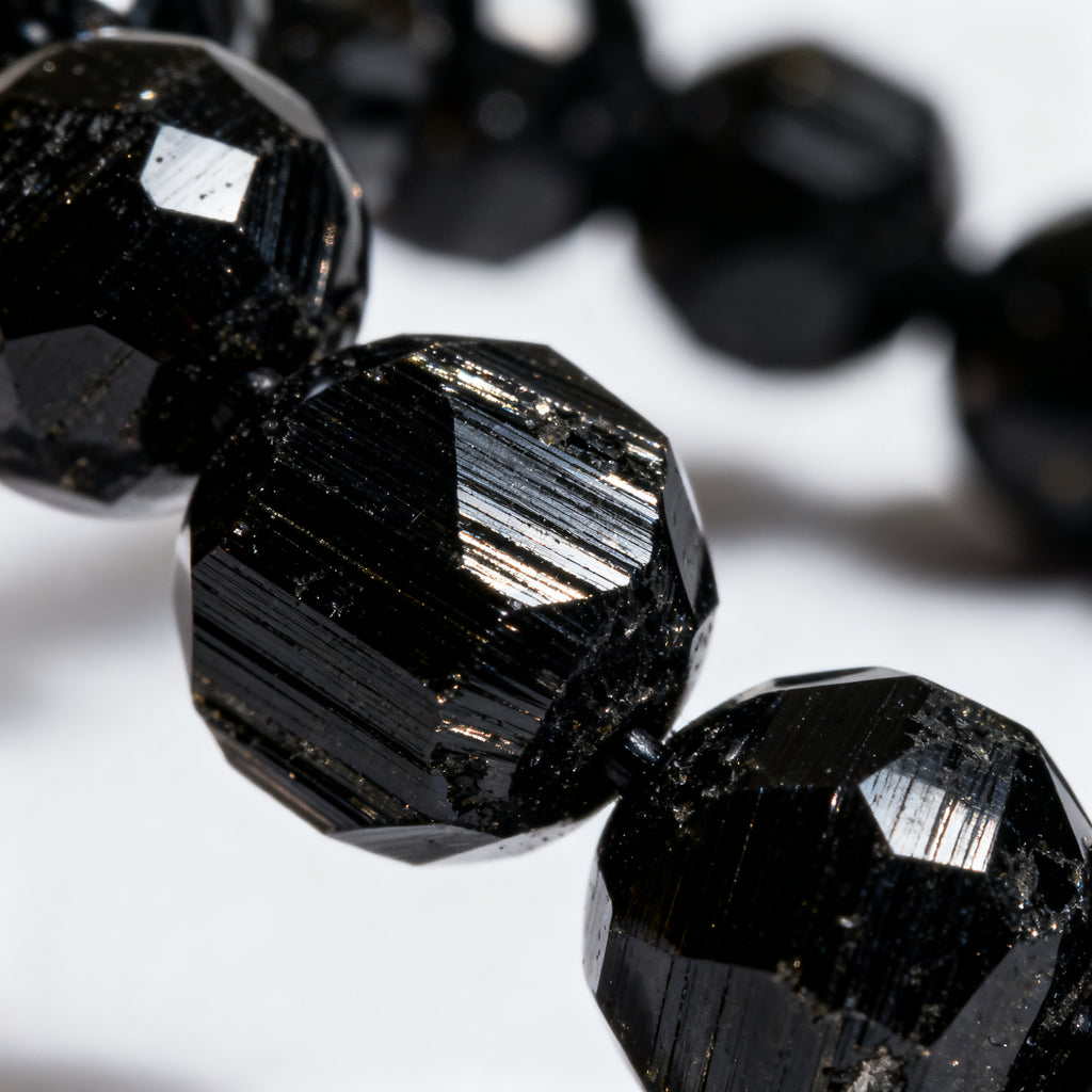 Closeup detail of Black Tourmaline crystal beads - natural striations texture